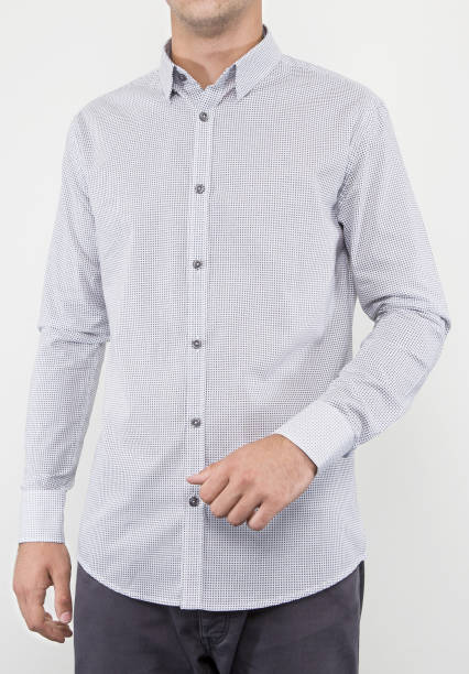 istock Handsome and confident young man wearing shirt while standing on white background. 1204133774