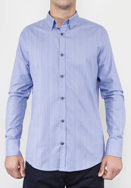 istock Handsome and confident young man wearing shirt while standing on white background. 1204133823