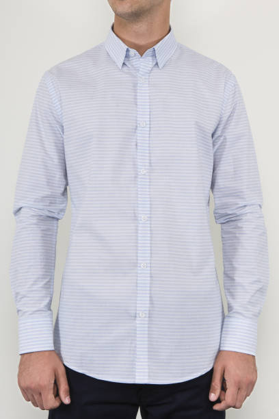 istock Handsome and confident young man wearing shirt while standing on white background. 1204133888