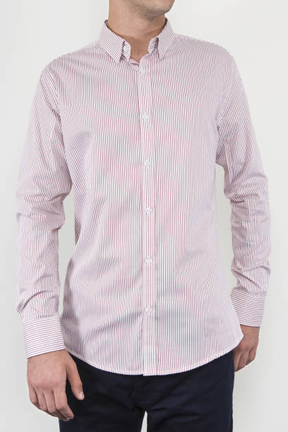 istock Handsome and confident young man wearing shirt while standing on white background. 1204134002
