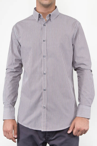 istock Handsome and confident young man wearing shirt while standing on white background. 1204134318