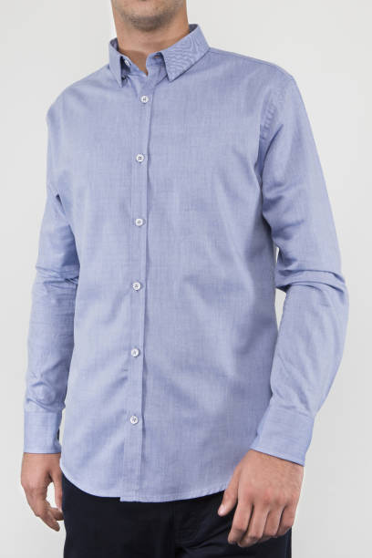 istock Handsome and confident young man wearing shirt while standing on white background. 1204134365