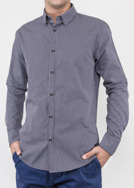 istock Handsome and confident young man wearing shirt while standing on white background. 1204135269
