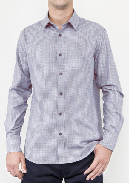 istock Handsome and confident young man wearing shirt while standing on white background. 1204135508