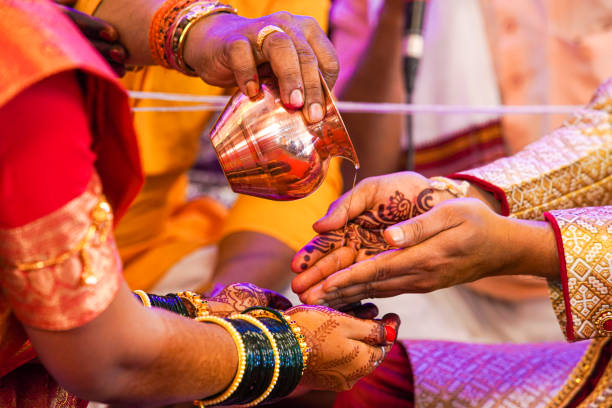 istock Indian traditional wedding ceremony bridal and groom hand 1204136314