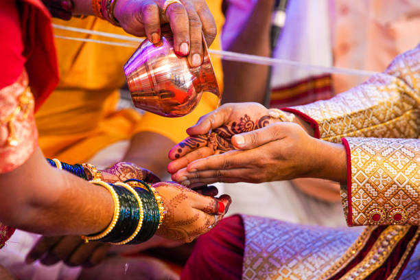 istock Indian traditional wedding ceremony bridal and groom hand 1204136407