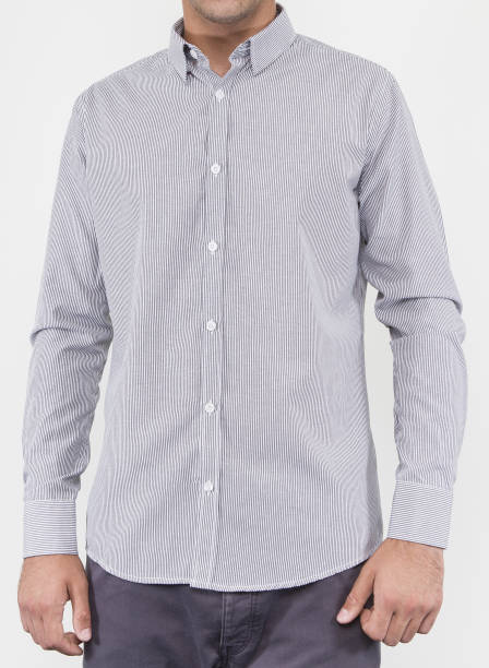 istock Handsome and confident young man wearing shirt while standing on white background. 1204136957