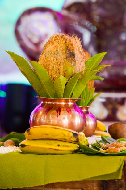 istock Indian wedding ceremony : decorative coper kalash with green leaf and coconut 1204137623