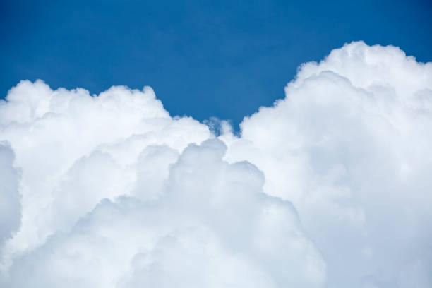 istock Blue sky background and white clouds soft focus, and copy space 1204139844