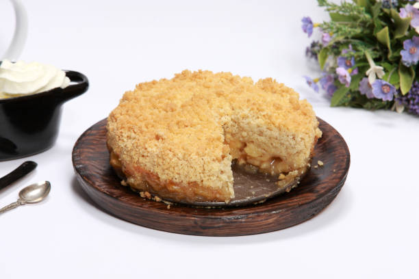 istock Freshly made Apple Crumble or Pie on wooden platter 1204148986