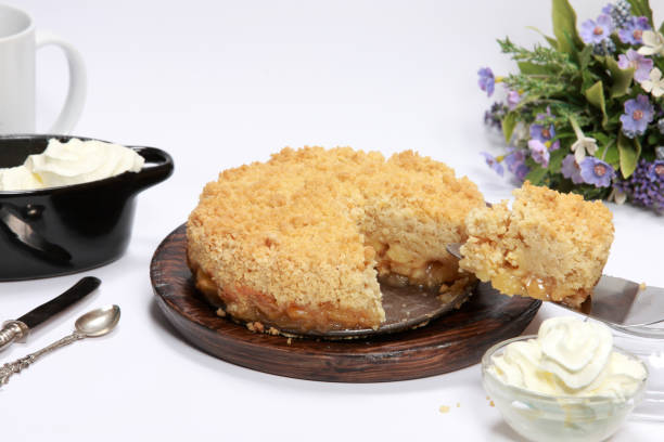 istock Freshly made Apple Crumble or Pie on wooden platter 1204148992