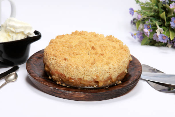 istock Freshly made Apple Crumble or Pie on wooden platter 1204148993