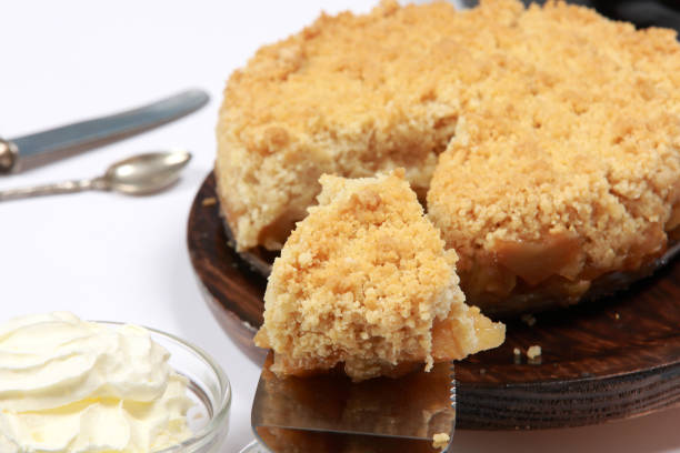 istock Freshly made Apple Crumble or Pie on wooden platter 1204148994