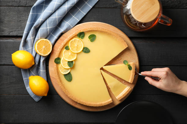 istock Composition with lemon tart on dark wooden background, top view 1204150343