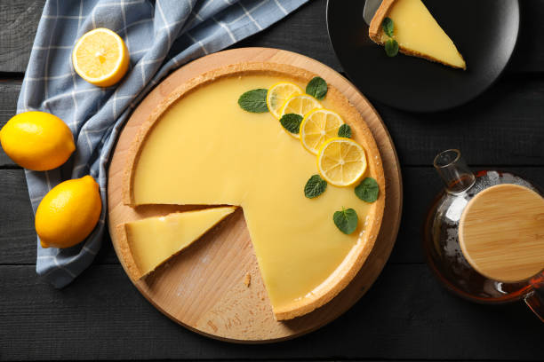istock Composition with lemon tart on dark wooden background, top view 1204150411