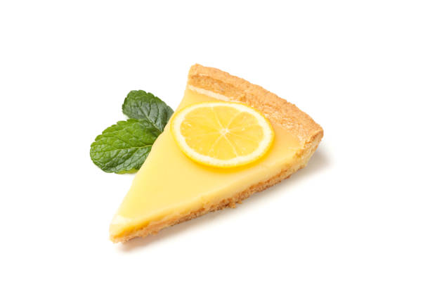 istock Lemon tart slice and mint isolated on white background 1204150615