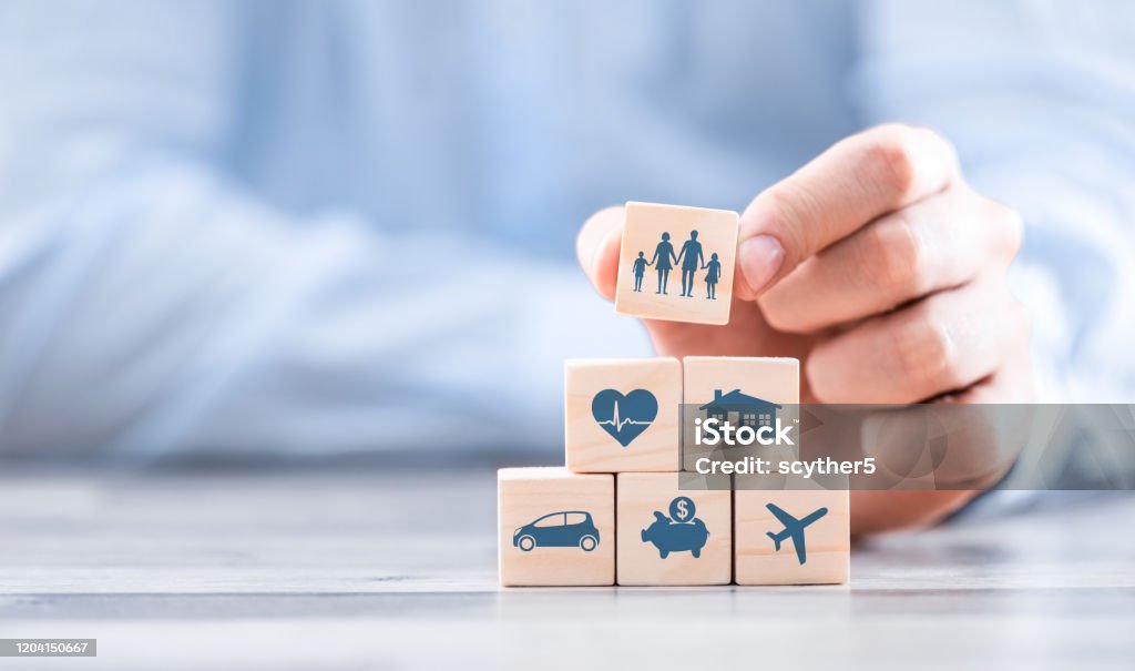 Life insurance concept. Wooden blocks with icons of various types of insurance. Life insurance concept. Insurance Stock Photo