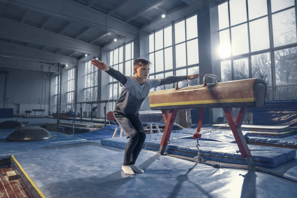 little male gymnast training in gym, flexible and active - child little boys male caucasian imagens e fotografias de stock