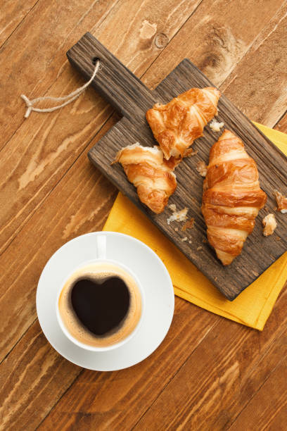 istock Breakfast with coffee and croissants 1204152527