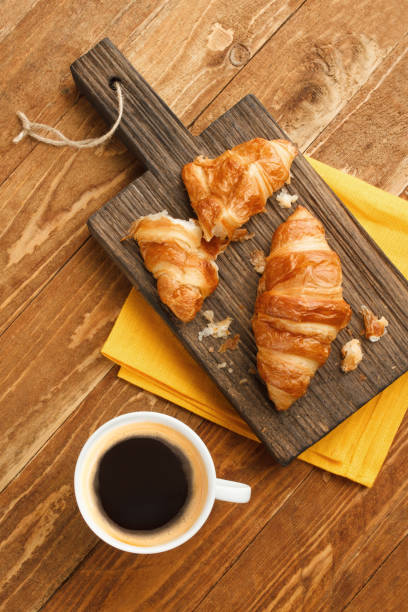 istock Breakfast with coffee and croissants 1204152532