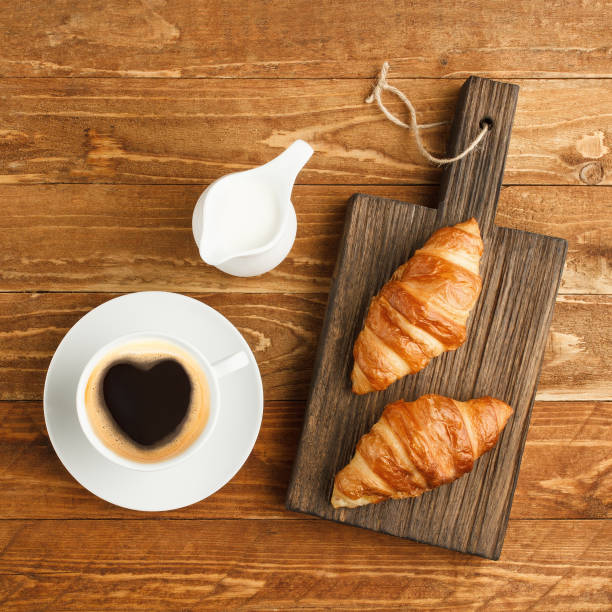 istock Breakfast with coffee and croissants 1204152536