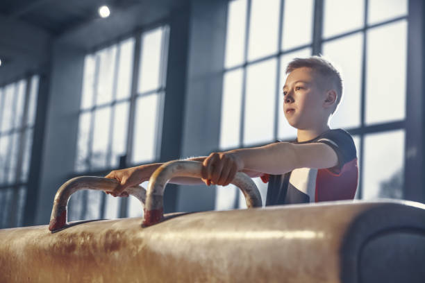 little male gymnast training in gym, flexible and active - child little boys male caucasian imagens e fotografias de stock