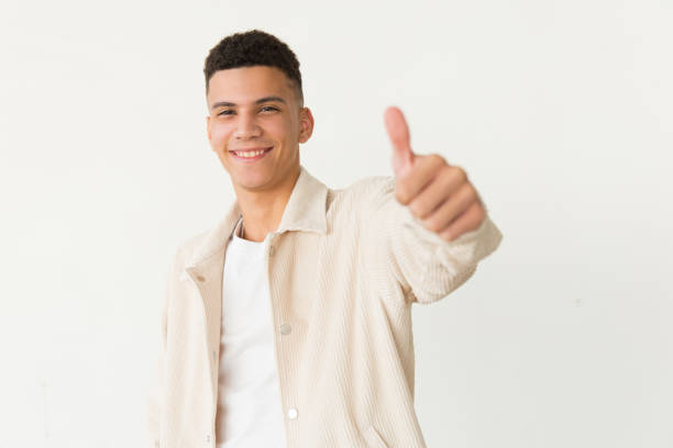 istock Handsome young man showing thumb up 1204153620