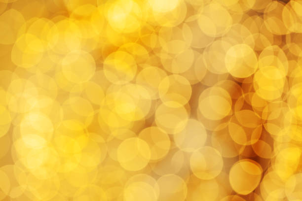 istock Abstract gold glitter lights texture bokeh background 1204154564