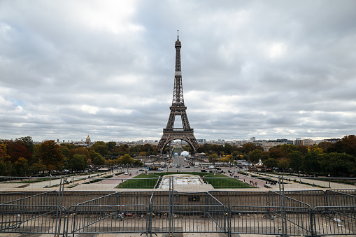 View of Eiffel tower in autumn season at dramatic sky background
