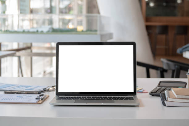 istock modern office workspace desk with blank screen laptop computer and office supplies 1204155287