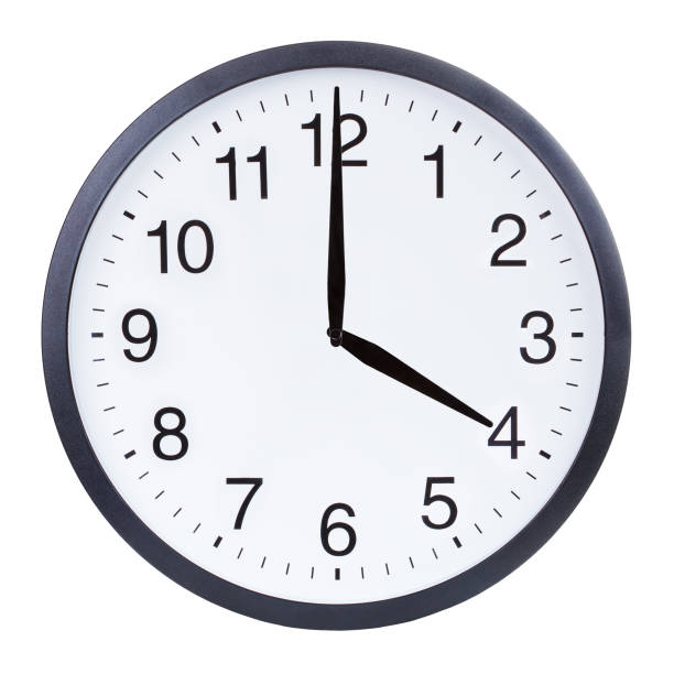 istock Round office clock showing four o'clock isolated on white background 1204156135