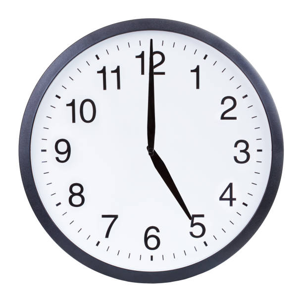 istock Round office clock showing five o'clock isolated on white background 1204156141