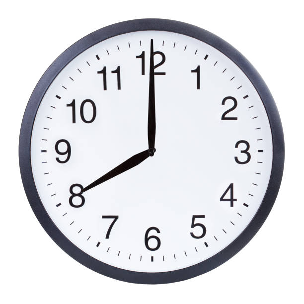 istock Round office clock showing eight o'clock isolated on white background 1204156147