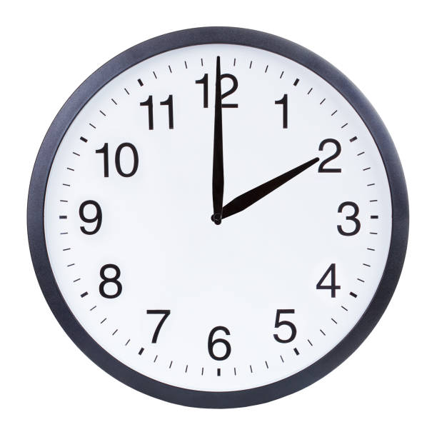 Round office clock showing two o'clock isolated on white background Round office clock showing two o'clock isolated on white background minute hand photos stock pictures, royalty-free photos & images