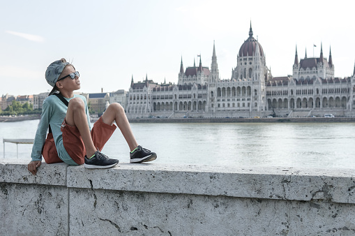Happy cute boy in centre of Budapest. Travel concept