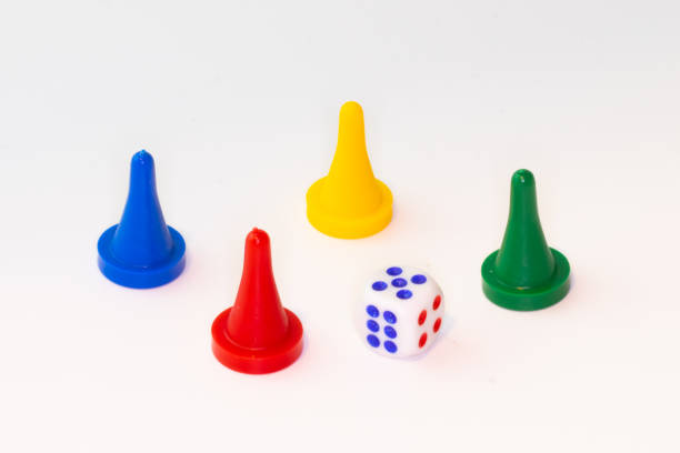 istock Four tokens with dice on white background 1204159133