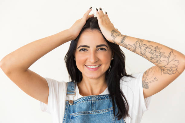 istock Cheerful young woman smiling at camera 1204160990