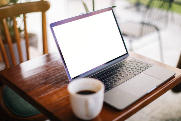 istock Blank Screen Laptop and Coffee Cup at Cafe 1204161050
