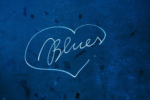 Blues writing inside a heart shape