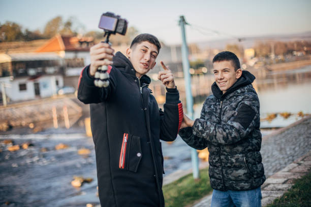 istock Two young teenage boys vlogging 1204161782