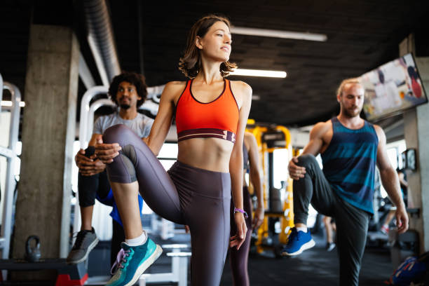istock Healthy young athletes friends doing exercises at gym. 1204163435