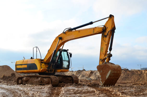 istock Tracked excavator working at a construction site during laying or replacement of underground storm sewer pipes 1204163687