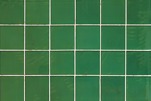 Green wall with square tiles