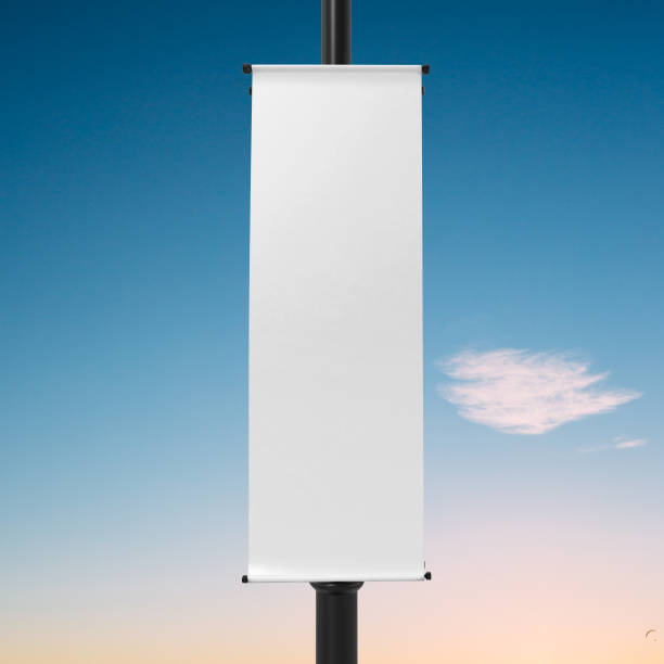 istock White Lamp Post Banner Mockup, 3d Rendering Isolated on Blue sky Background 1204165481