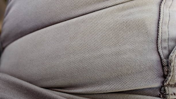 istock Gray fabric texture, with folds, selectively focused 1204165912