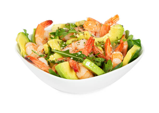 istock Salad with avocado, shrimp and arugula in white bowl 1204167271