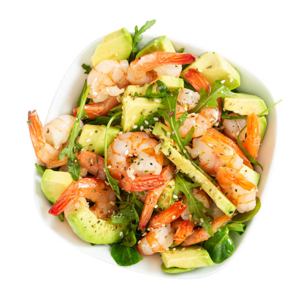 istock Salad with avocado, shrimp and arugula in white bowl 1204167284