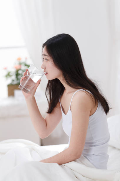 istock Young women drink water 1204167840