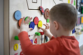 Boy playing with the interactive board