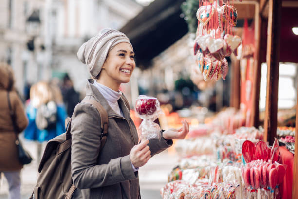 Lady buying sweets at the street
